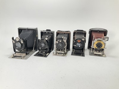 Lot 647 - A Selection of Five Folding Cameras