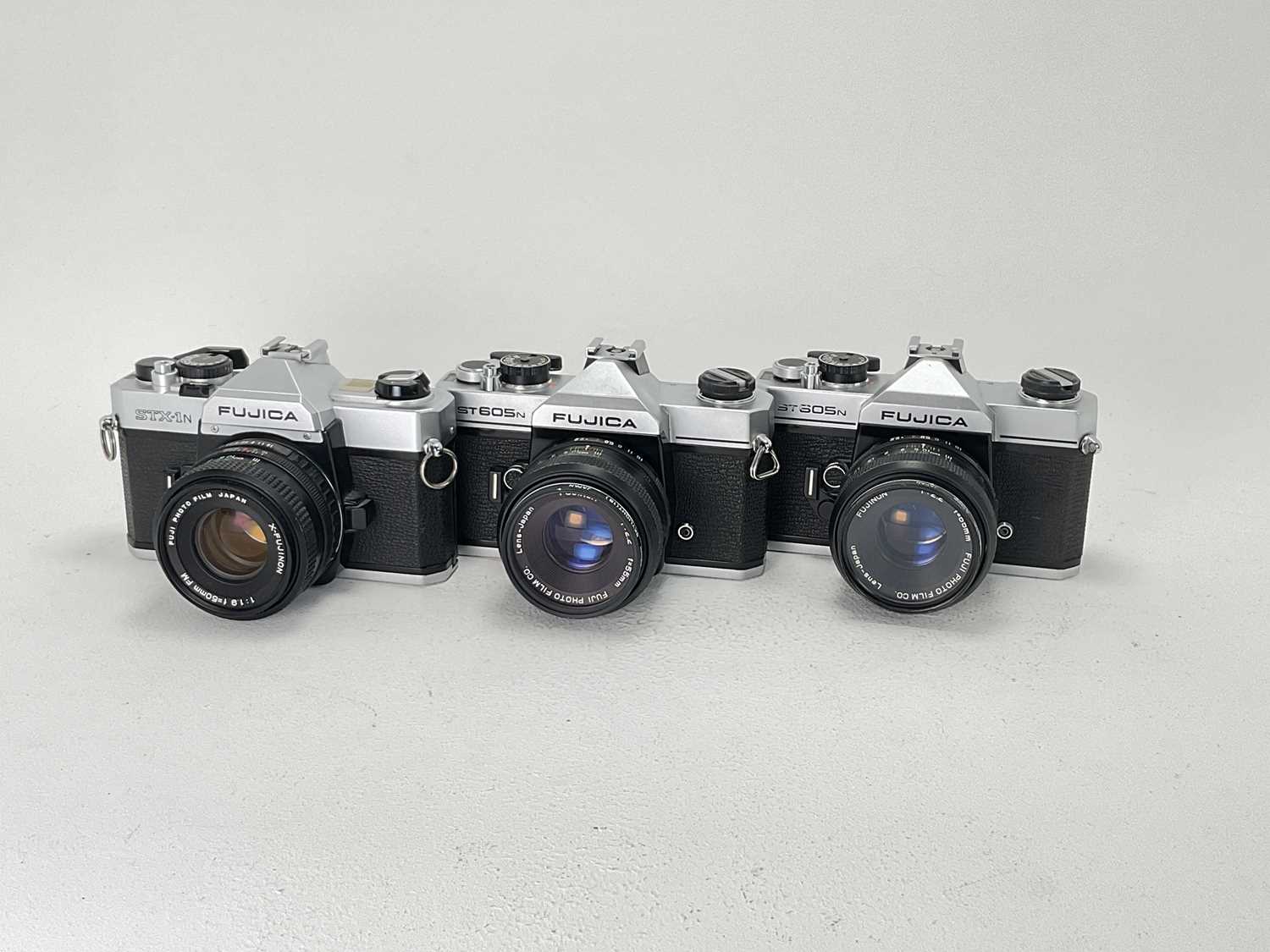 Lot 555 - Three Fujica 35mm SLR Cameras