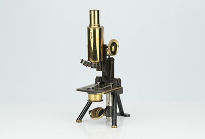 Lot 234 - A Brass Microscope By Swift & Sons