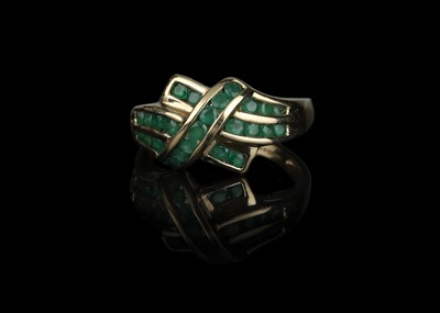 Lot 607 - 9 ct Gold Channel Set Emerald Crossover Dress Ring