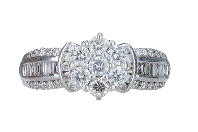 Lot 619 - A Diamond Dress Ring.