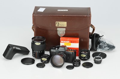 Lot 127 - A Pentax Auto 110 SLR Camera Outfit
