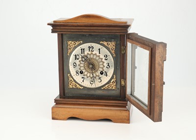 Lot 629 - A Victorian Walnut and Stained Beech Mantle Clock