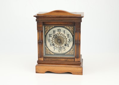 Lot 629 - A Victorian Walnut and Stained Beech Mantle Clock