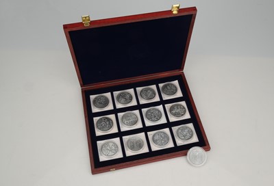 Lot 56 - A boxed set of silver plated coins commemorating the History of Christianity