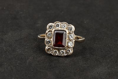 Lot 116 - A 9 ct Gold Diamond and Garnet Cluster Ring