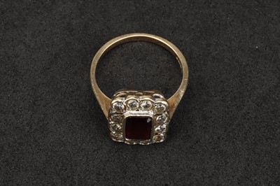 Lot 116 - A 9 ct Gold Diamond and Garnet Cluster Ring