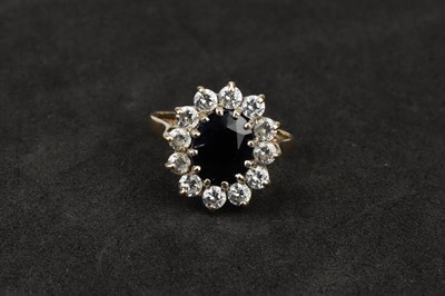 Lot 122 - A 9 ct Gold Sapphire and Cubic Zirconia Cluster Ring