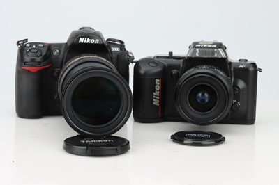 Lot 666 - Two Nikon SLR Cameras.