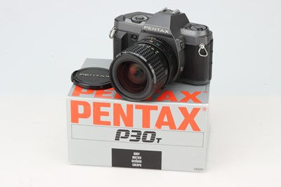 Lot 665 - A Pentax P30T 35mm SLR Camera Outfit