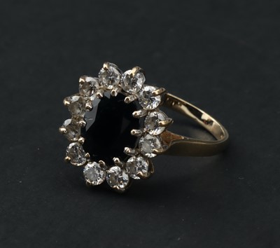 Lot 108 - A 9 ct Gold Sapphire and Cubic Zirconia Cluster Ring