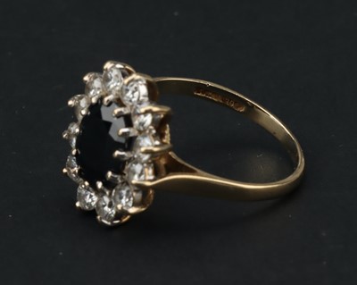 Lot 108 - A 9 ct Gold Sapphire and Cubic Zirconia Cluster Ring