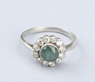 Lot 140 - An Art Deco Diamond and Emerald Platinum Cluster Ring