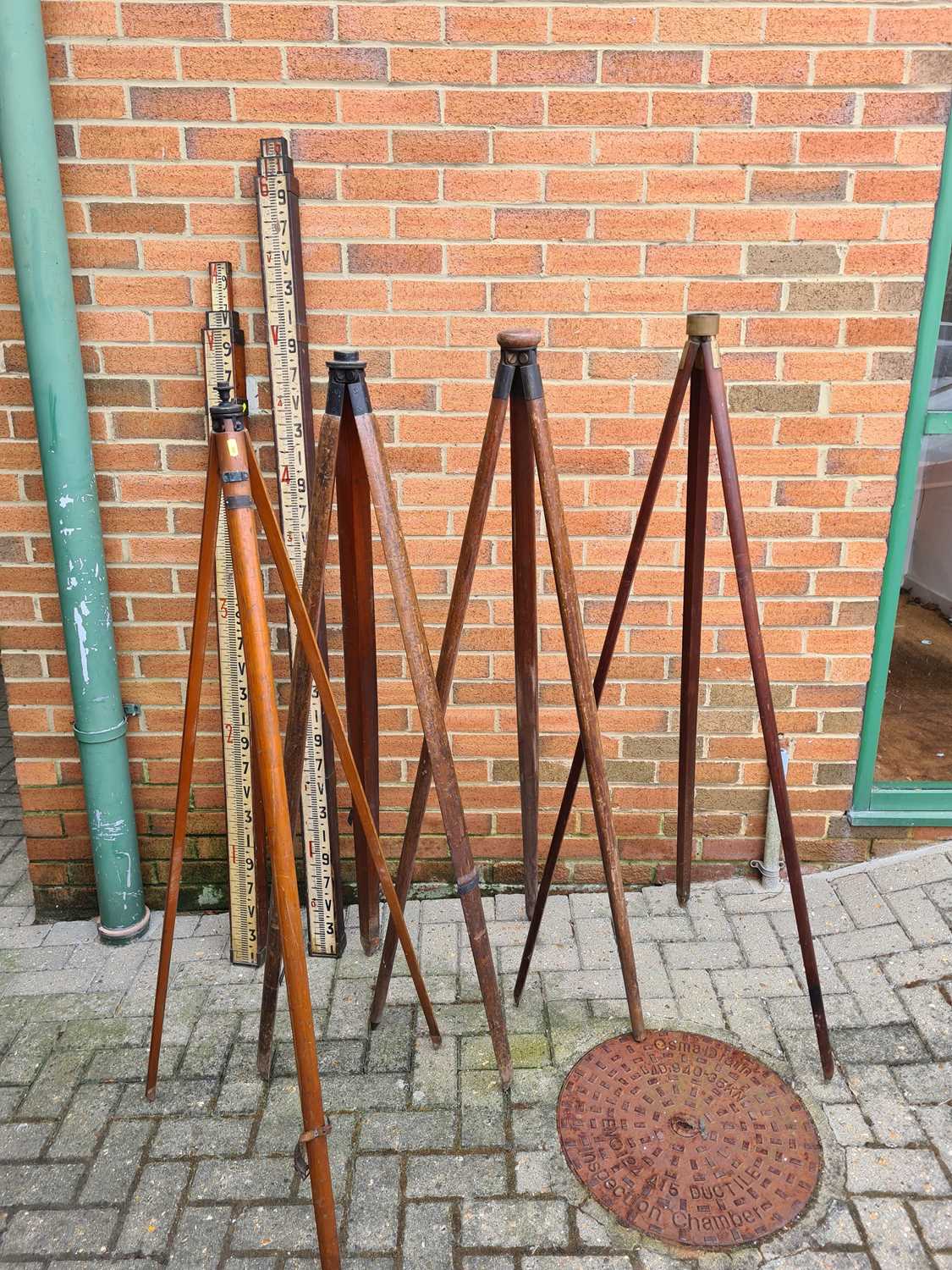 Lot 314 - A Collection of Surveyors Tripods and Staffs,