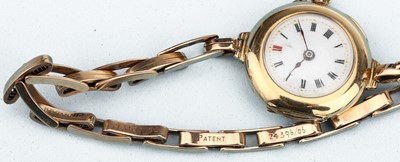 Lot 166 - A 15 ct Gold Trench Watch