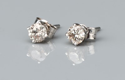 Lot 158 - A Pair of 14 ct White Gold Solitaire Stud Earrings