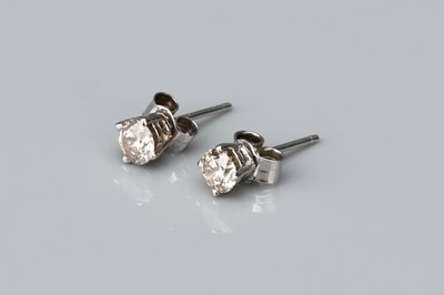 Lot 158 - A Pair of 14 ct White Gold Solitaire Stud Earrings