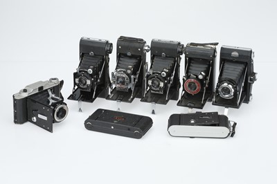 Lot 394 - A Selection of Eight Folding Cameras