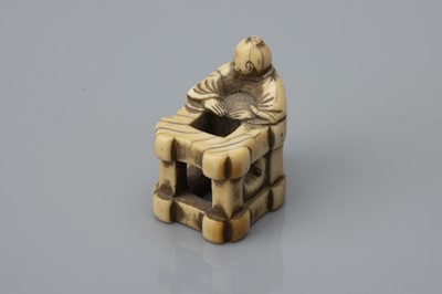 Lot 76 - An Edo Period Ivory Netsuke as a Karako with Box Crate