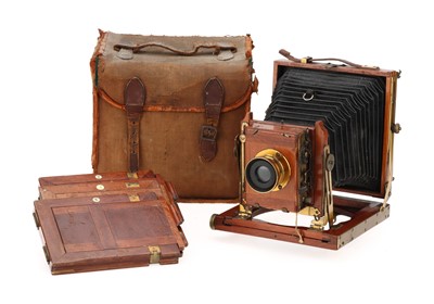 Lot 691 - A T.E.B. No.1A Mahogany & Brass Quarter Plate Folding Bed Camera