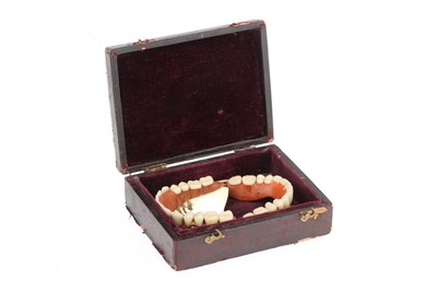 Lot 21 - A Complete Set of Sprung Dentures in Gold & Porcelain