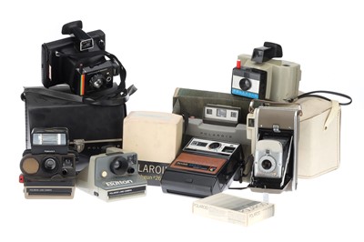 Lot 558 - A Selection of Instant Cameras & Accessories