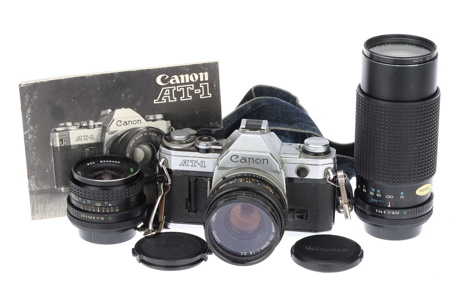 Lot 402 - A Canon AT-1 with lenses