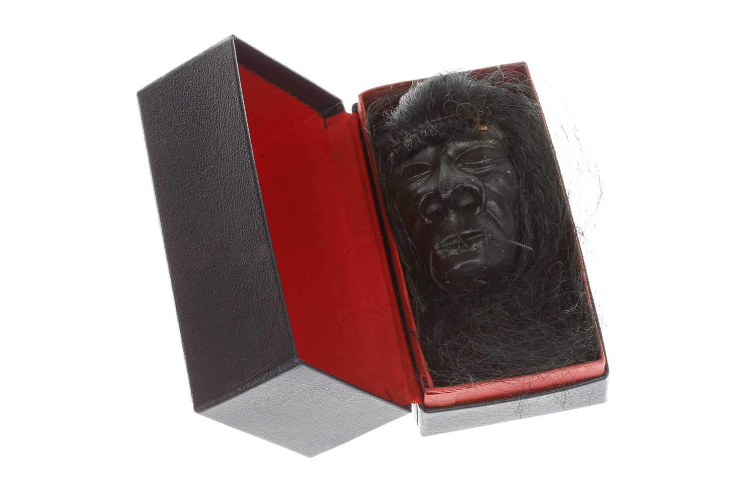 Lot 243 - A Small Box Containing a Novelty Shrunken Head