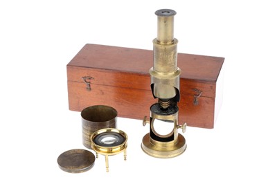 Lot 112 - A Toy Microscope & Map Reader