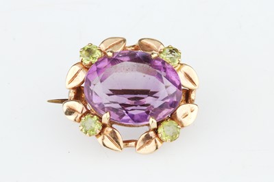 Lot 210 - An Edwardian Oval Cut Amethyst Brooch