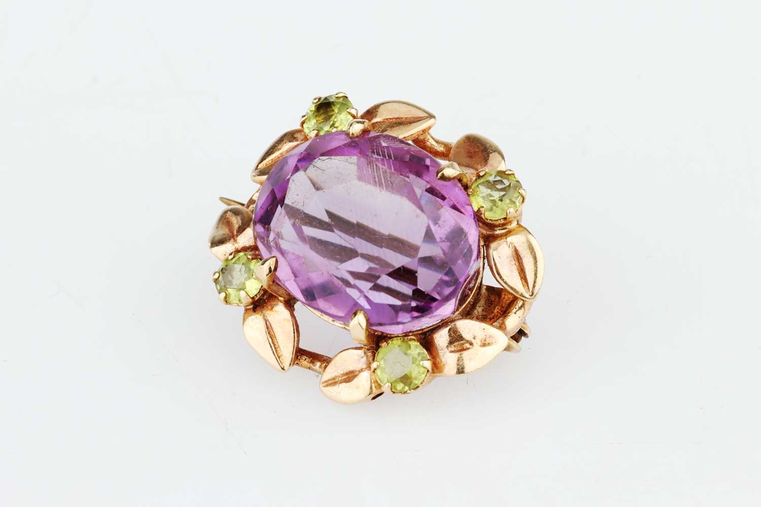 Lot 210 - An Edwardian Oval Cut Amethyst Brooch