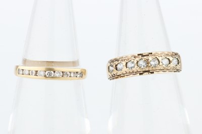 Lot 204 - 18 ct Gold Chanel Set Diamond Nine Stone Ring