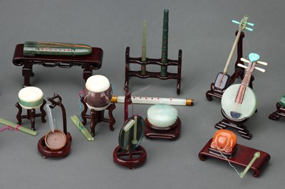 Lot 88 - A Boxed Set of 20 Mid-Twentieth Century Chinese Jade Carved Musical Instruments