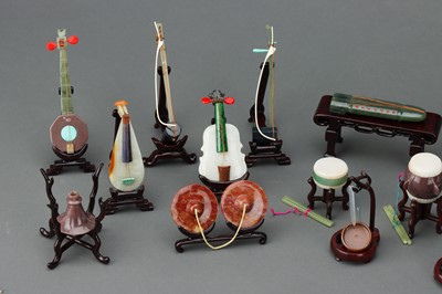 Lot 88 - A Boxed Set of 20 Mid-Twentieth Century Chinese Jade Carved Musical Instruments