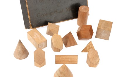 Lot 290 - A Red Marble Cuboctahedron and other  wooden Geometrical Models