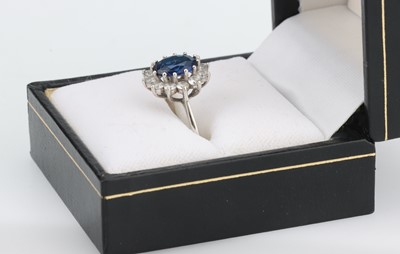 Lot 38 - A 9 ct White Gold Sapphire Cluster Ring