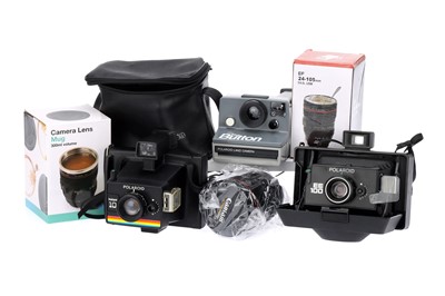 Lot 438 - Three Polaroid Cameras & Two Lens Mugs