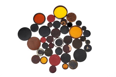 Lot 557 - A Good Selection of Early Leather Lens Caps