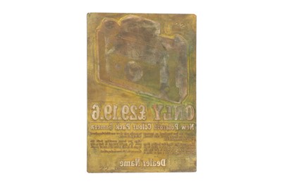 Lot 926 - A Brass Printing Plate for a Polaroid Advert