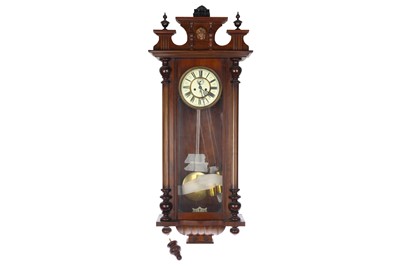 Lot 375 - A 19th century oak cased Vienna style wall clock with twin train weight driven movement by Gustav Becker