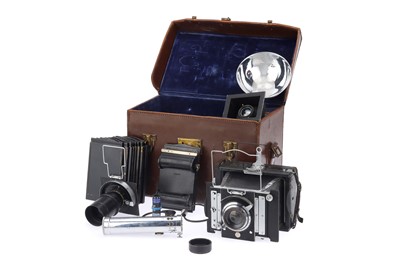 Lot 815 - A Van Neck Pressmaster Folding Strut Camera Outfit