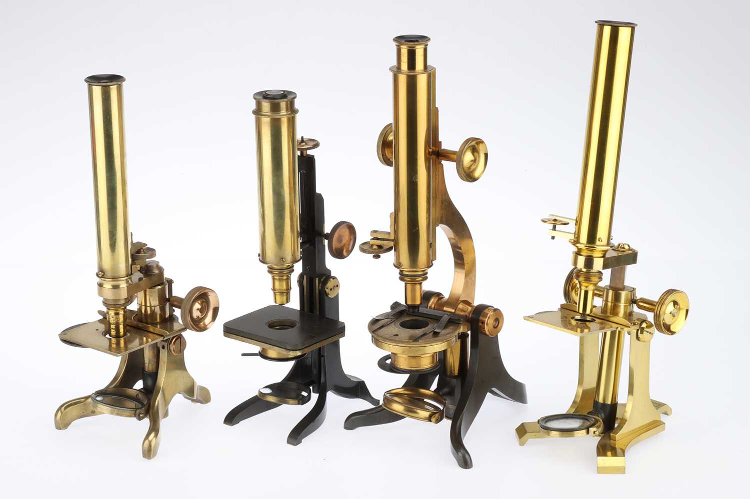 Lot 709 A Collection of 4 Compound Microscopes,
