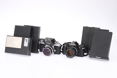 Lot 96 - A Nikon F Photomic FTn and a Canon A-1 SLR Cameras