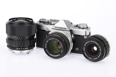 Lot 182 - An Olympus OM-1 35mm SLR Camera Outfit