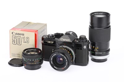 Lot 166 - A Canon EF 35mm SLR Camera Outfit