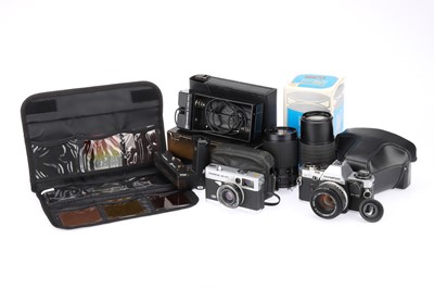 Lot 177 - An Olympus OM10 35mm SLR Camera Outfit