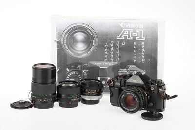 Lot 64 - A Canon A-1 35mm SLR Camera and Lenses