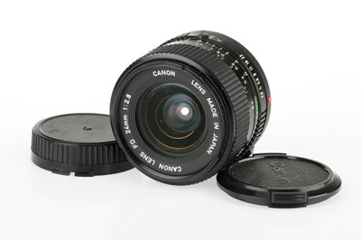 Lot 64 - A Canon A-1 35mm SLR Camera and Lenses