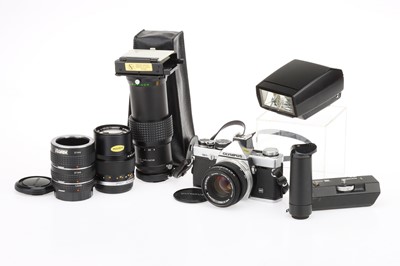 Lot 69 - An Olympus OM-2N 35mm SLR Camera Outfit