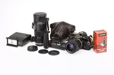 Lot 70 - An Olympus OM-2N 35mm SLR Camera Outfit
